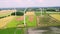 Aerial elevated partial orbit clip of wind turbines in the English countryside