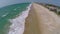 Aerial of empty beach and beach homes