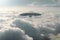 Aerial enigma, Alien UFO saucer soars above Earth\\\'s cloud-covered expanse