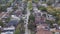 Aerial establishing shot of a generic residential area in a large city at dusk.