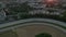 Aerial Establishing Shot of Harness Horse Race on dirt track in Sunset light, Drone perspective from above