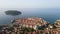 Aerial establishing shot of old town of Dubrovnik, Dalmatia, Croatia. Medieval city fortress on the coast of Adriatic