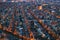 Aerial evening Amsterdam view with narrow canals, streets and historic buildings, view from above, Netherlands