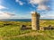 Aerial Famous Irish Tourist Attraction In Doolin, County Clare, Ireland. Doonagore Castle is a round 16th-century tower Castle.