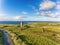 Aerial Famous Irish Tourist Attraction In Doolin, County Clare, Ireland. Doonagore Castle is a round 16th-century tower Castle.