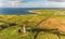 Aerial Famous Irish Tourist Attraction In Doolin, County Clare, Ireland. Doonagore Castle is a round 16th-century tower Castle.