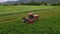 Aerial farm tractor cutting hay farmer broken machine 4K
