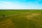 Aerial. Farming and agriculture industry. Green grass texture background. Spring or summer background with green grass