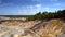 Aerial flight along steep slopes of clay quarry