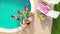 Aerial flight : group of young friends hanging out together by the pool with drinks