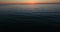 Aerial flight, low altitude above sea water. Baltic sea clear sunset