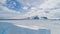 Aerial flight over Antarctica iceberg, ocean.