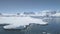 Aerial flight over Antarctica shoreline, ocean.