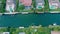 Aerial flight over beautiful homes on a Florida canal