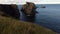 Aerial flight over a cliff and rocky islands on the Atlantic Coast in Newfoundland Canada.