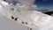 AERIAL: Flight over mountain covered with snow