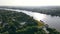 Aerial Flight over the pier for small pleasure boats on the banks of a large river.