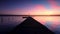 Aerial flight over small dock and boat at the lake