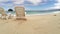 Aerial flight : two Empty chair on a beach by the ocean