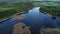 Aerial flight view of blue lake in forest