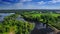 AERIAL Fly over clear blue river and green native forest in middle Europe, Russia, Tatarstan