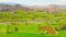 Aerial fly over scenic spring panorama of blooming trees and mountains, countryside in Turke