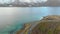 Aerial fly over tilted shot with view of islands and coastal road in northen Norway Lofoten islands