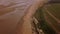 Aerial flyby of Old Hunstanton beach and cliffs in Winter