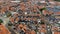 Aerial flying above the typical Dutch houses of Volendam showing the typical lines of homes and street this harbor town