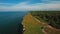 Aerial flying along the coast with a view of the coastline with cliffs from the sea and on land The Old Lighthouse