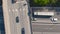 AERIAL: Flying along a large truck driving down the busy motorway on a sunny day