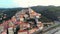 Aerial: flying around Cervo medieval town on the mediterranean coast, Liguria riviera, Italy, with the beautiful baroque church an