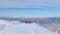 AERIAL: Flying around three ski tourers after reaching the snowy mountaintop.