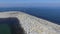 Aerial flying breakwater of stone