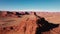 Aerial Flying Canyon With Red Rocks Butte In Dried Desert With Red Sandstone Usa