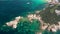 Aerial flying on Costa Smeralda, blue water waves in the Mediterranean Sea on white beach in Sardinia.