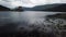 Aerial Flying Forward Over Water Toward Scottish Castle On Island Tilt Up