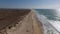 Aerial. Flying over the beach and the tourist village of Carvoeiro.