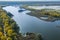 Aerial Flying over countryside, many lakes of fish farm, far big river under amazing cloudy sky in autumn time. Wonderful drone