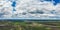 Aerial Flying over countryside under dramatic cloudy sky