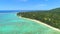 AERIAL: Flying over the spectacular coral reef and towards oceanfront resort.