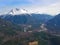 AERIAL: Flying over vast forest and towards the snowy mountains in Bella Coola.