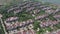 Aerial flying shot of many luxurious homes in an upscale area