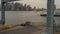 Aerial: flying trough big blue cargo industrial crane revealing New York City skyline and east river on a cloudy day