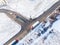 Aerial Follow Shot of White Semi Truck with Cargo Trailer Attached Moving Through Industrial Warehouse, Rural Area