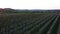 Aerial footage of an agricultural area and green rolling fields.