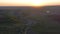 Aerial footage of an agricultural area and green rolling fields.