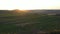 Aerial footage of an agricultural area and green rolling fields.