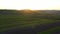 Aerial footage of an agricultural area and green rolling fields.