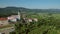 Aerial footage of ancient village Vipava cross above vipava valley with church of santa cross